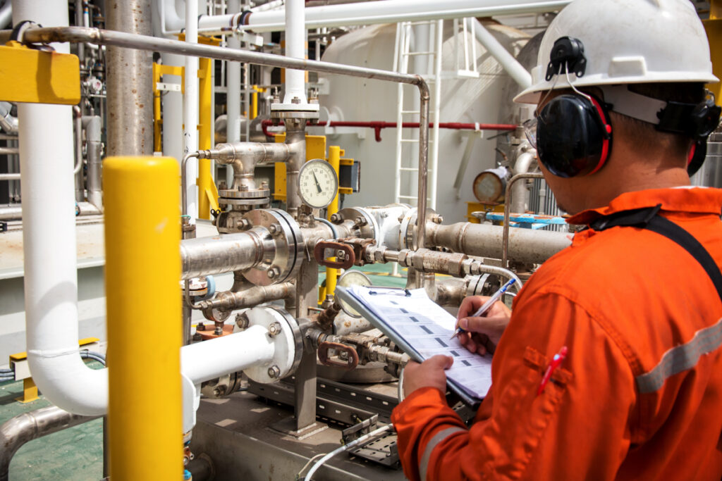 Industrial technician performing inspection