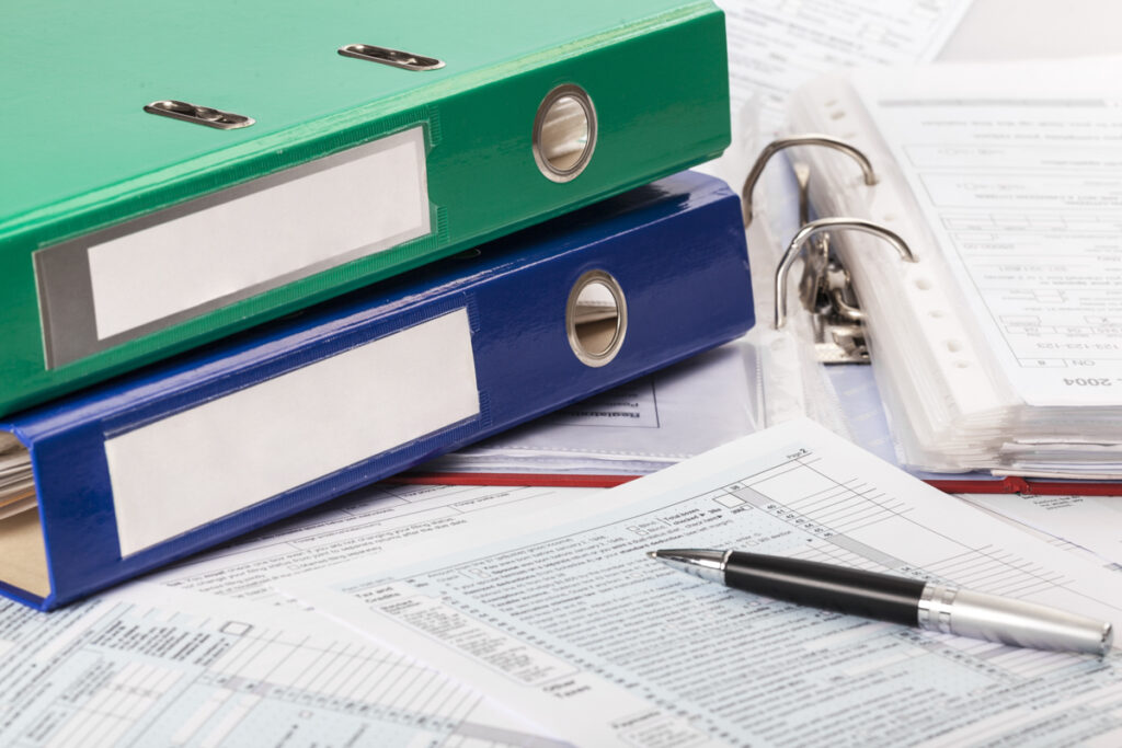 Written business plans spread out on a desk