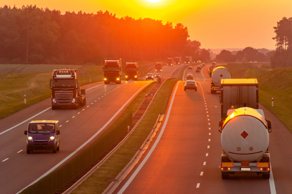 Trucks and cars driving down the highway